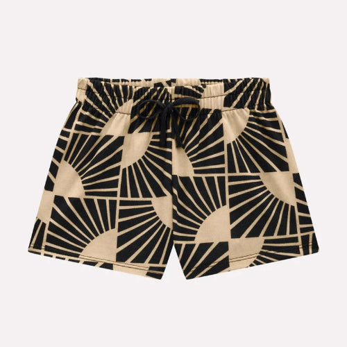 Beige and black patterned shorts on a light beige background